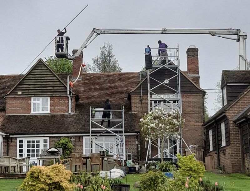 The Roof Moss Cleaners using cherry picker and scaffolding to clean roof safely and professionally in Milton Keynes, Buckinghamshire